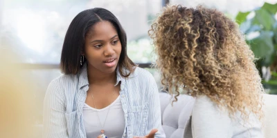 two women talking intently